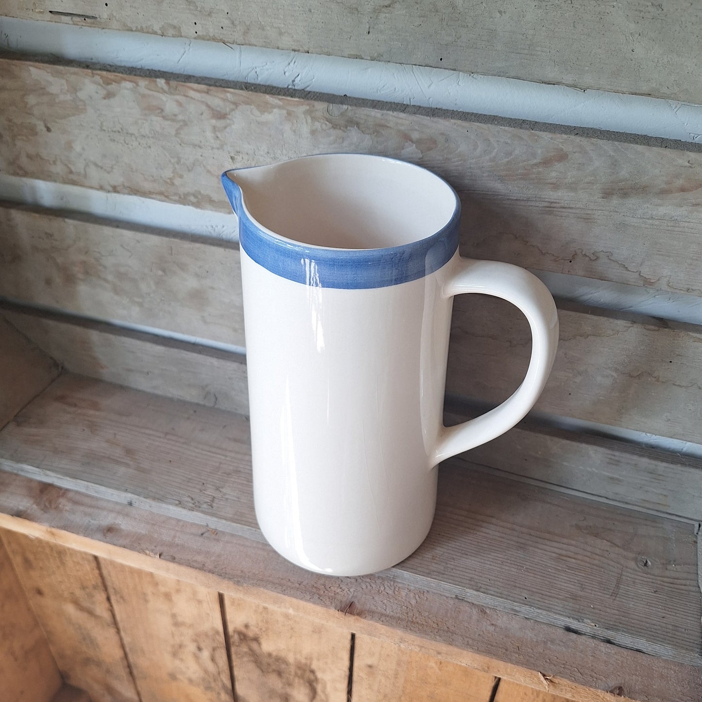 Rustic White Ceramic Jug with Blue Rim