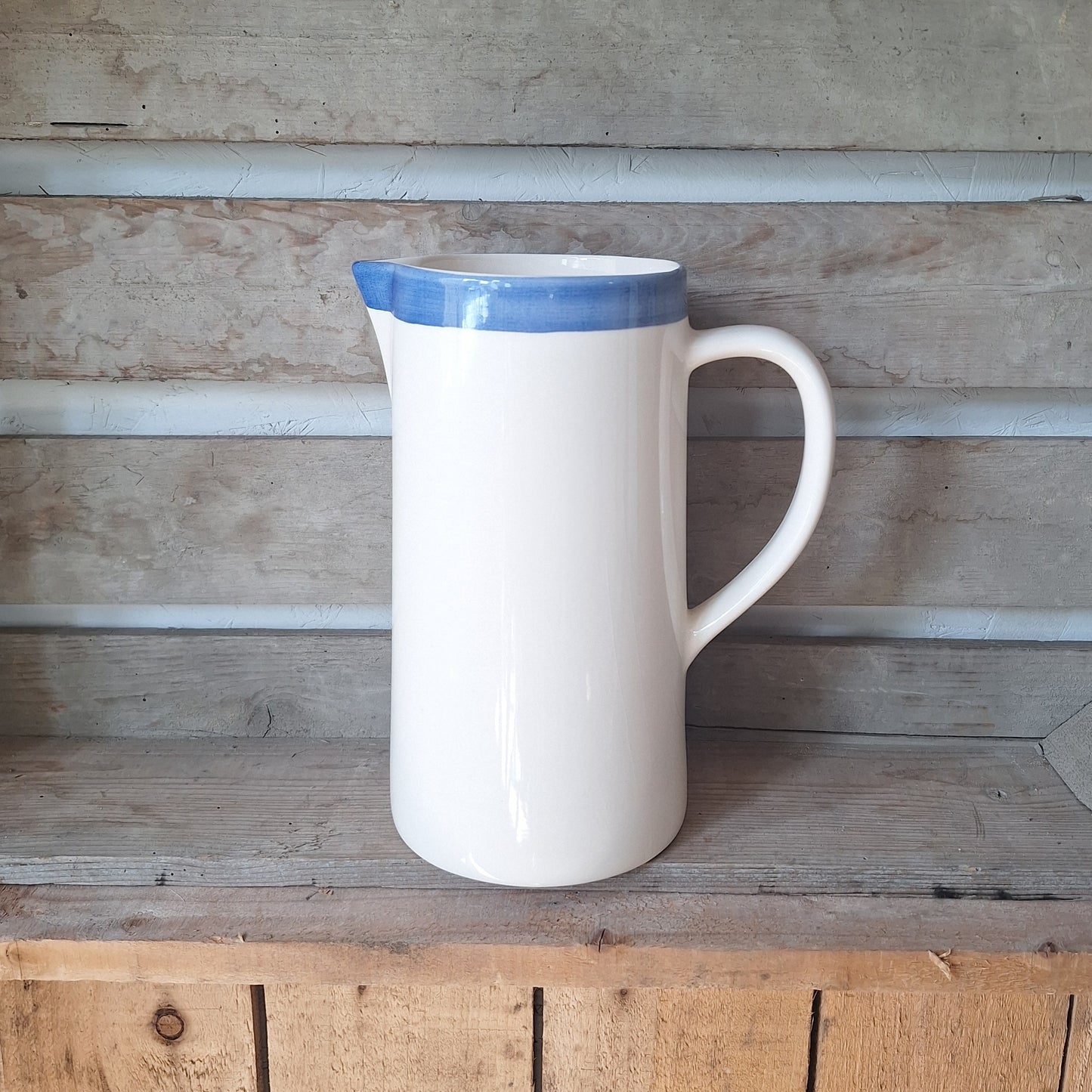Rustic White Ceramic Jug with Blue Rim
